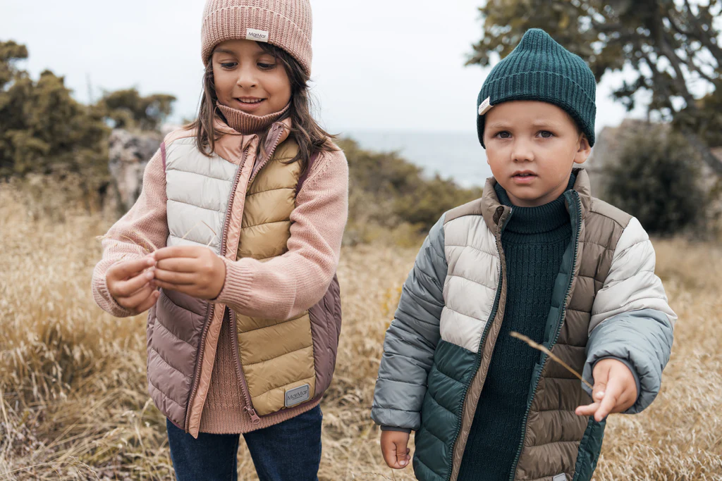 Two kids wearing MarMar clothing in Denmark in nature.